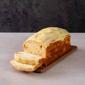 a whole loaf cake with a golden crust